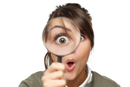 Woman with magnifying Glass